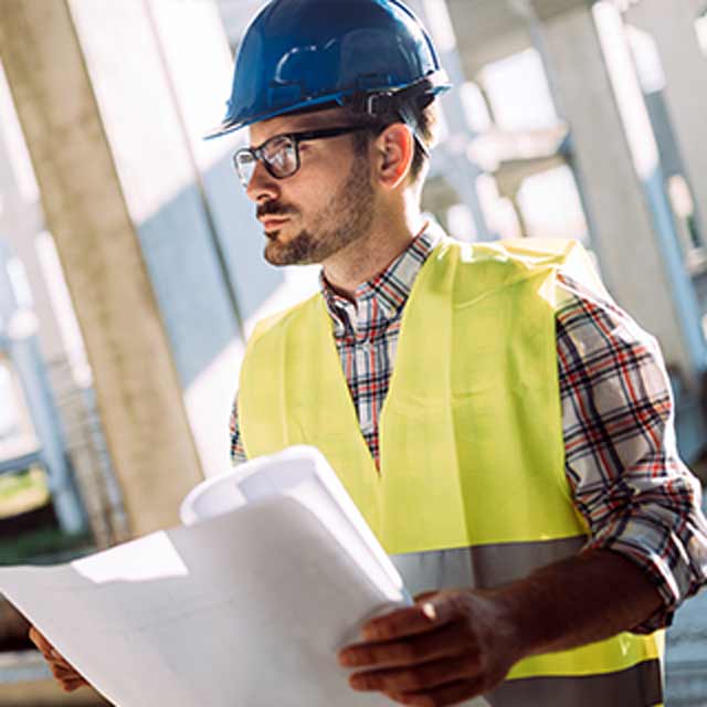 Person Looks At Away While Wearing Hard Hat Glasses